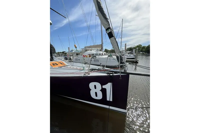 Slide: The Image of Sailboat Class 40 Akilaria RC2, 2009 model, docked with number 81 visible. - 28