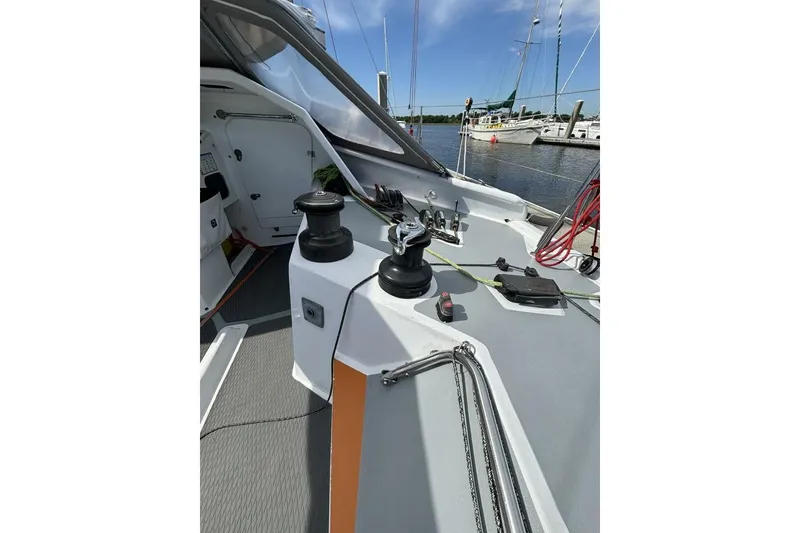 Slide: The Image of 2009 Class 40 Akilaria RC2 yacht deck with winches and ropes, docked at marina. - 34