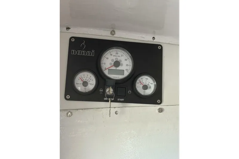 Slide: The Image of Instrument panel of 2009 Class 40 Akilaria RC2 sailboat with gauges and controls. - 42