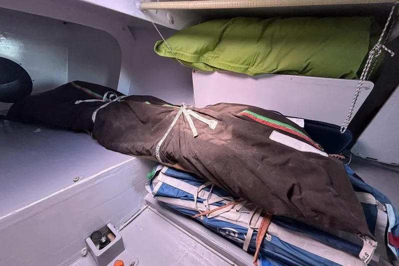 Slide: The Image of Interior of 2009 Class 40 Akilaria RC2 sailboat with stored sails and gear. - 45