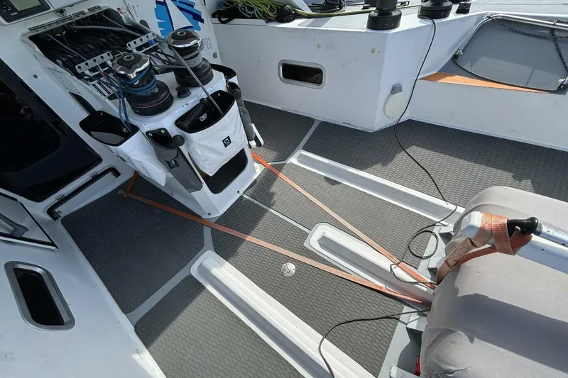 Slide: The Image of Cockpit of 2009 Class 40 Akilaria RC2 sailboat with winches and ropes. - 54