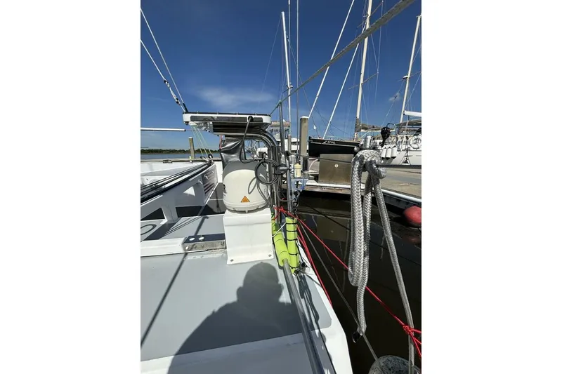 Slide: The Image of Sailboat deck view of 2009 Class 40 Akilaria RC2, featuring rigging and marina backdrop. - 60