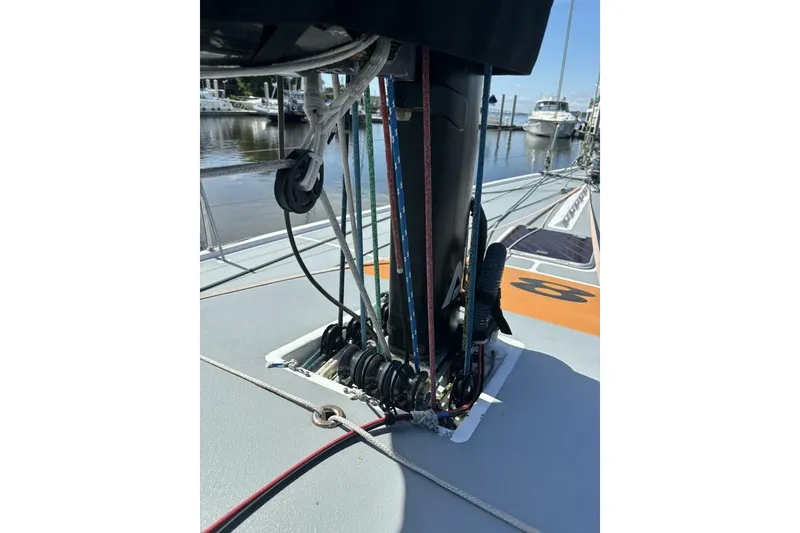 Slide: The Image of 2009 Akilaria RC2 sailboat deck with rigging and ropes, docked at marina. - 61