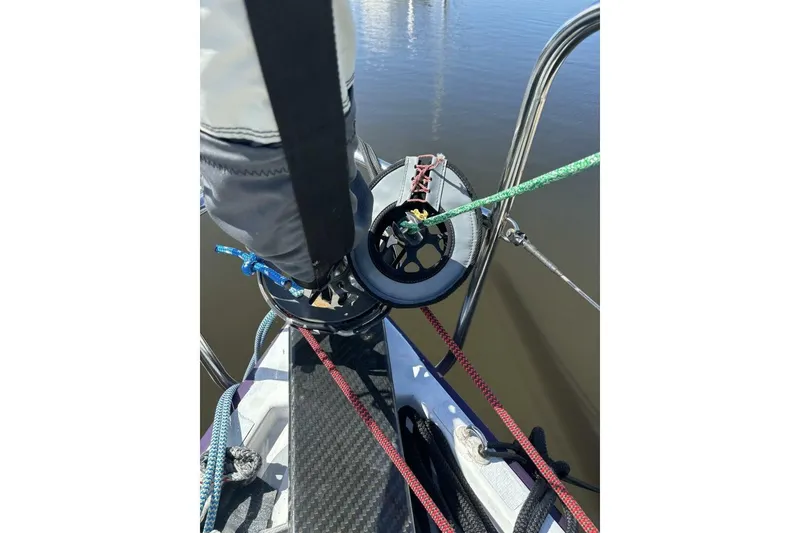 Slide: The Image of Close-up of Akilaria RC2 sailboat rigging, featuring ropes and deck details. - 62