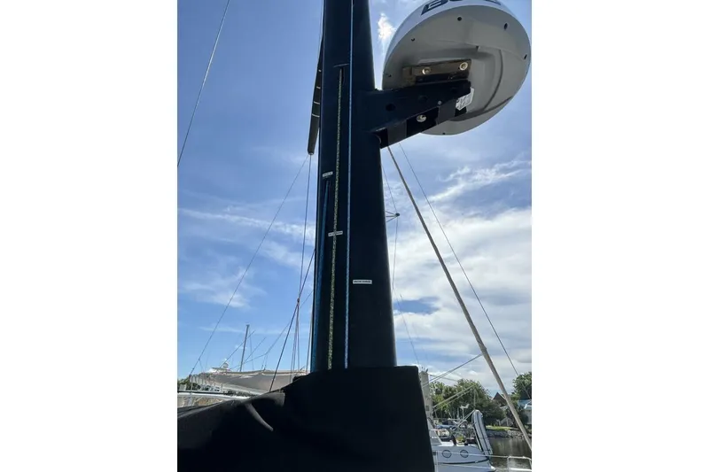 Slide: The Image of Mast of 2009 Class 40 Akilaria RC2 sailboat against blue sky. - 66