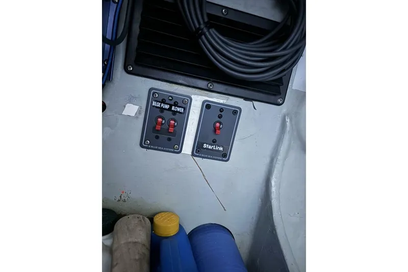 Slide: The Image of Control panel on 2009 Akilaria RC2 sailboat with bilge pump and StarLink switches. - 75