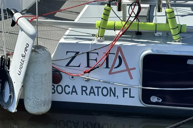 Slide: The Image of Sailboat "Zeta" docked, featuring "Watt & Sea" equipment, Boca Raton, FL, 2009 Akilaria RC2. - 77