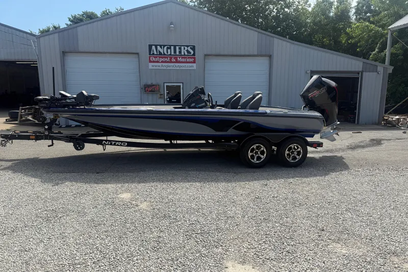 Slide: The Image of 2021 Nitro Z20 Pro boat on trailer outside Anglers Outpost & Marine building. - 18