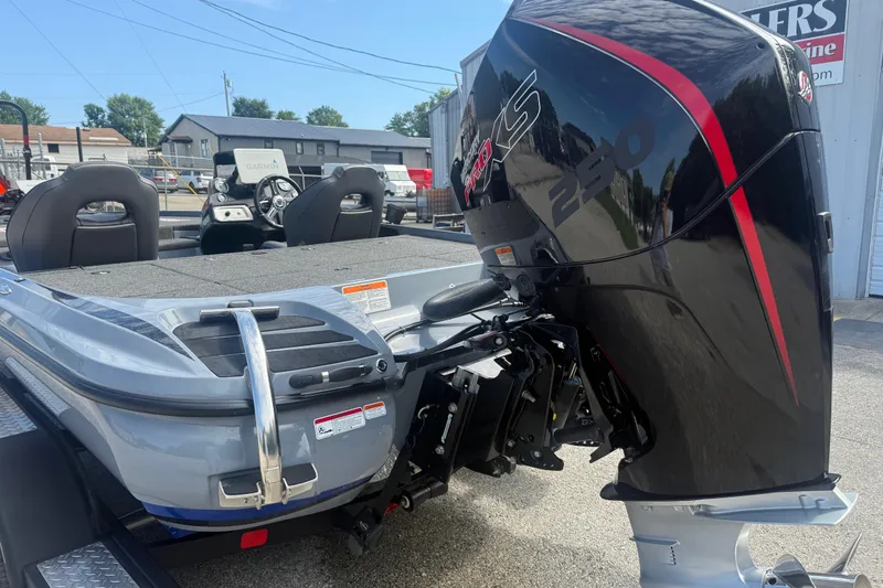 Slide: The Image of 2021 Nitro Z20 Pro boat with powerful black and red engine, parked outdoors. - 20