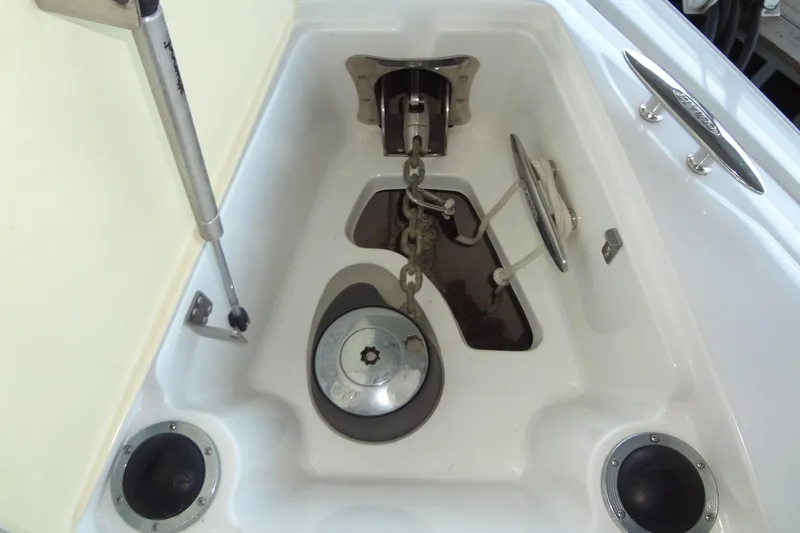 Slide: The Image of Anchor compartment of 2008 Cobalt 302 boat with chain and winch system. - 11