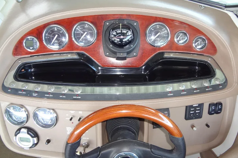 Slide: The Image of 2008 Cobalt 302 dashboard with wood accents and multiple gauges. - 19
