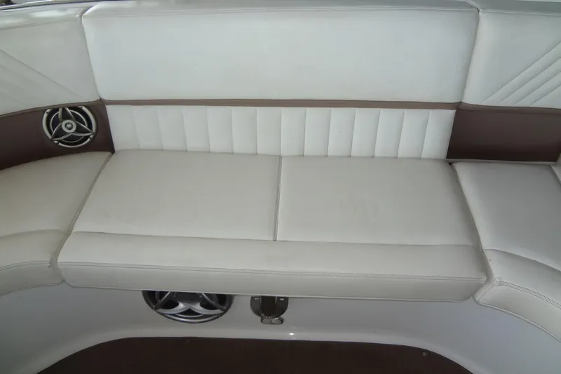 Slide: The Image of White leather seating on a 2008 Cobalt 302 boat with built-in speakers. - 26