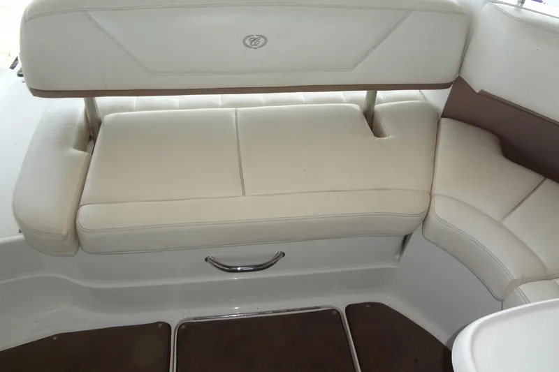 Slide: The Image of 2008 Cobalt 302 boat interior with white cushioned seating and sleek design. - 29