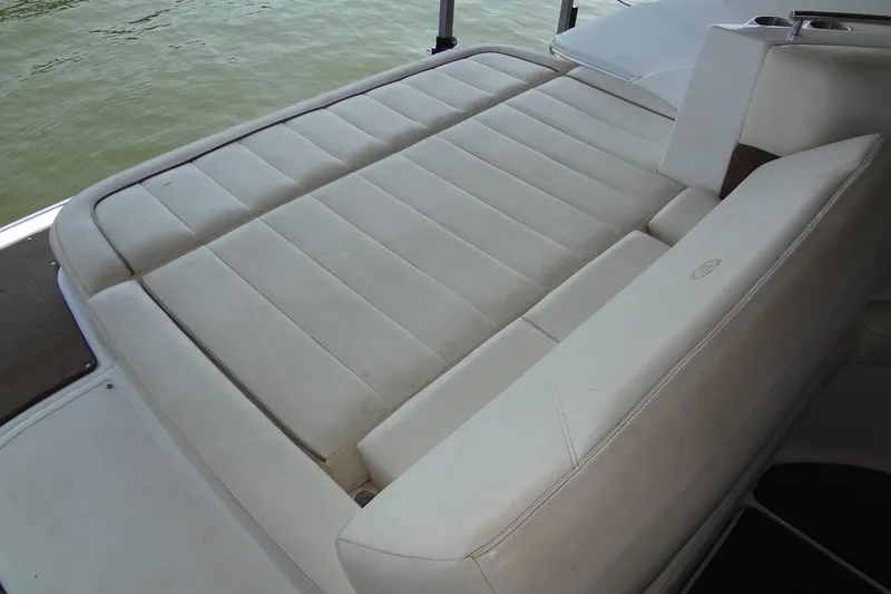 Slide: The Image of 2008 Cobalt 302 boat with spacious white leather seating on deck. - 31