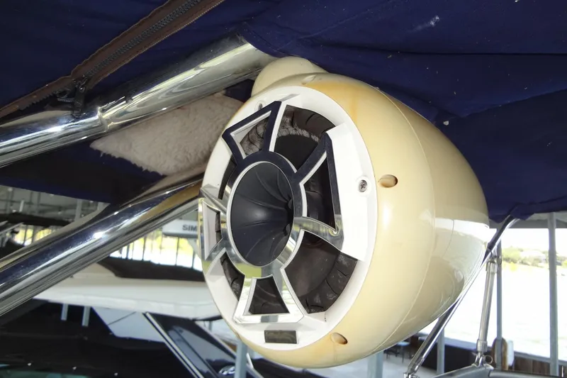 Slide: The Image of Speaker system on a 2008 Cobalt 302 boat, mounted under a blue canopy. - 34
