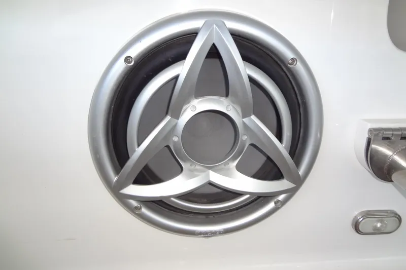 Slide: The Image of Close-up of a 2008 Cobalt 302 boat speaker with a sleek metallic design. - 36