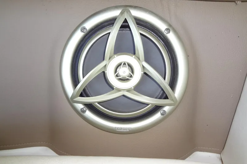 Slide: The Image of Kicker speaker in 2008 Cobalt 302 boat, mounted on beige interior panel. - 37