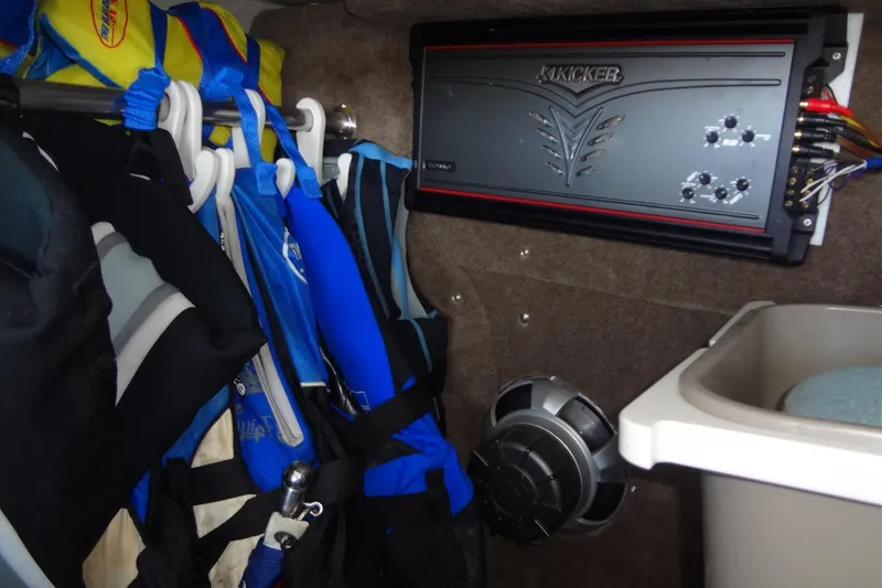 Slide: The Image of Storage area in a 2008 Cobalt 302 with life jackets and audio equipment. - 39