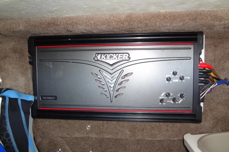 Slide: The Image of Kicker ZX700.5 amplifier installed in a 2008 Cobalt 302 boat. - 40