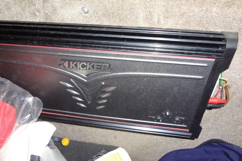 Slide: The Image of Kicker amplifier installed in a 2008 Cobalt 302 boat interior. - 41