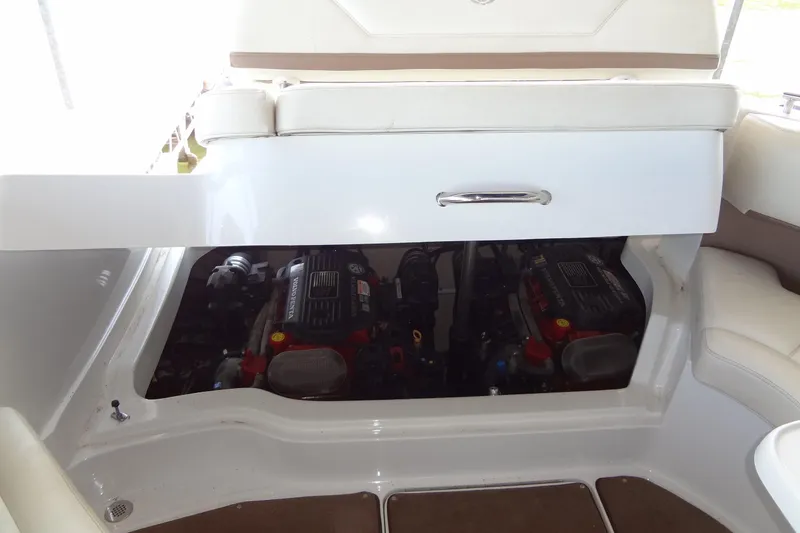 Slide: The Image of 2008 Cobalt 302 boat engine compartment with dual engines visible. - 42