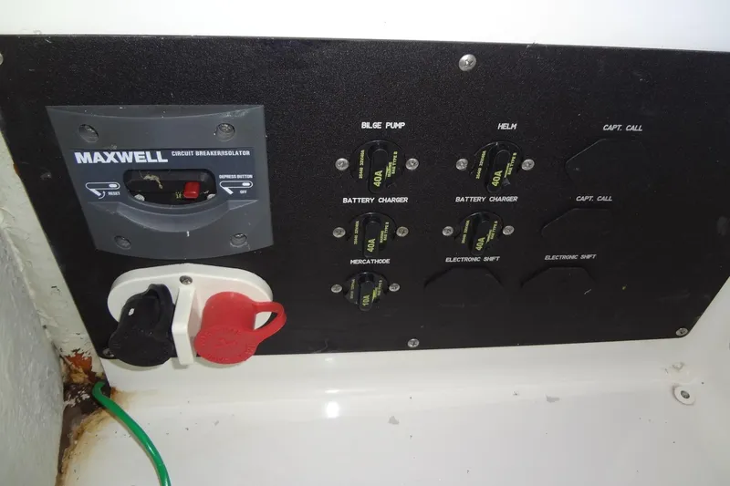 Slide: The Image of 2008 Cobalt 302 boat control panel with Maxwell circuit breaker and switches. - 50