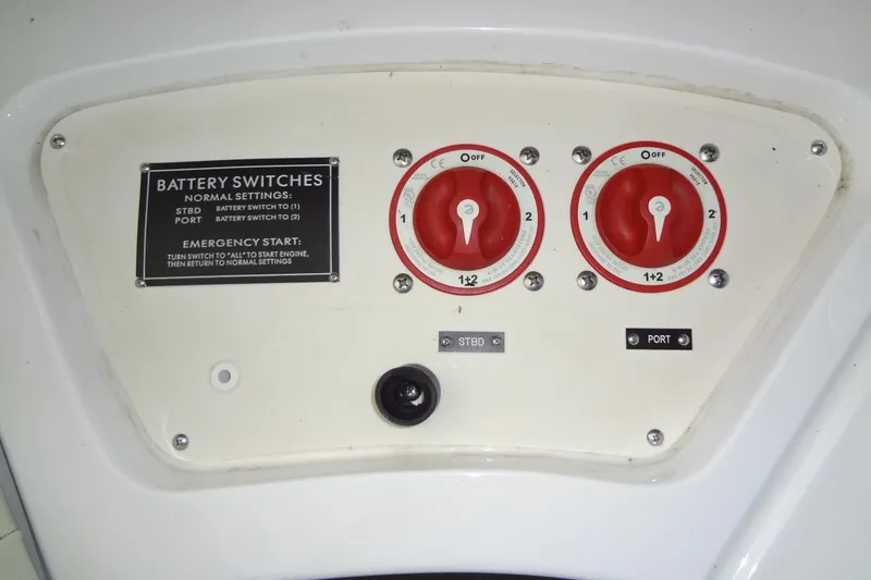 Slide: The Image of Battery switches panel on 2008 Cobalt 302 boat, featuring emergency start instructions. - 51