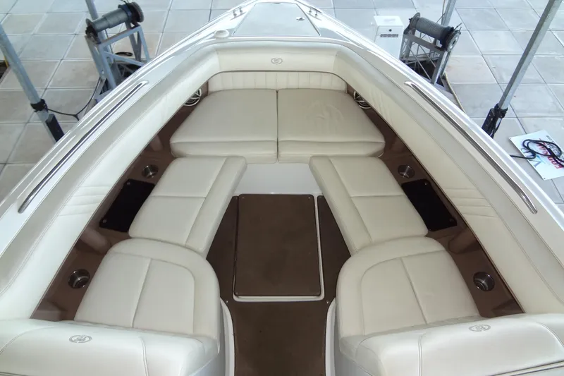 Slide: The Image of Luxurious interior of a 2008 Cobalt 302 boat with cream leather seating. - 9
