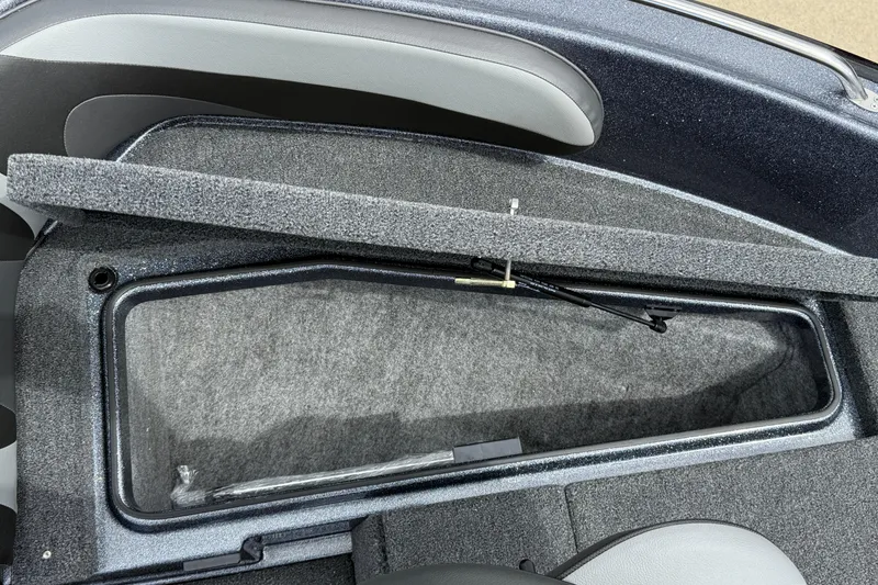 Slide: The Image of 2025 Lund 189 Tyee GL boat interior with gray seating and storage compartments. - 10