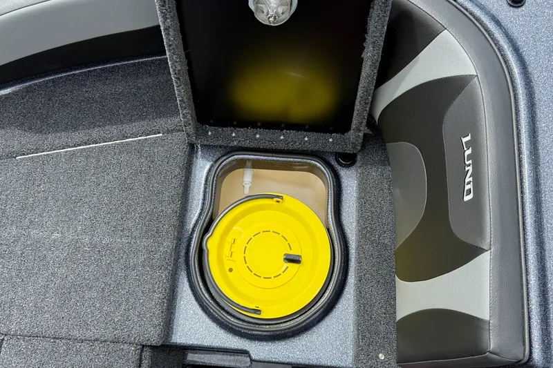 Slide: The Image of 2025 Lund 189 Tyee GL boat interior with gray seating and dashboard view. - 12