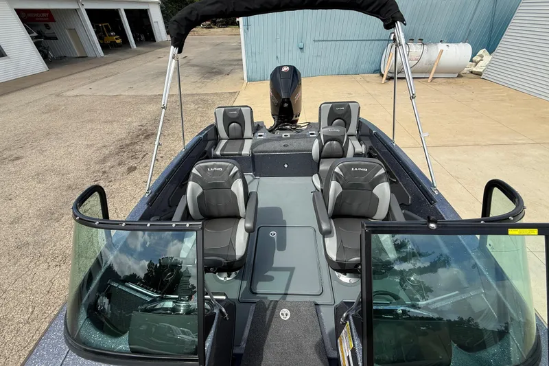 Slide: The Image of 2025 Lund 189 Tyee GL boat interior with storage compartment and yellow lid. - 15