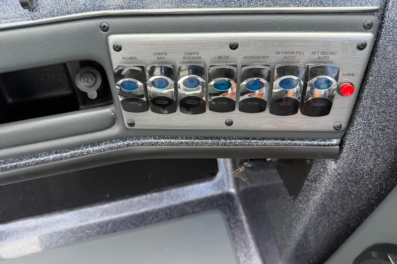 Slide: The Image of 2025 Lund 189 Tyee GL boat interior with sleek seating and windshield design. - 19