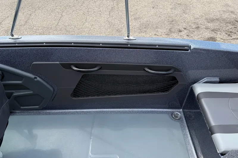 Slide: The Image of 2025 Lund 189 Tyee GL boat interior with gray seating and dashboard. - 24