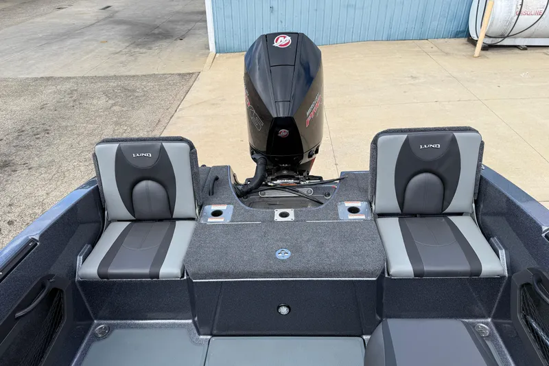 Slide: The Image of Interior view of 2025 Lund 189 Tyee GL boat, featuring storage compartment and seating. - 27