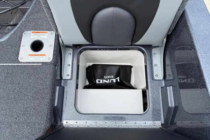 Slide: The Image of 2025 Lund 189 Tyee GL boat interior with four seats and motor. - 29