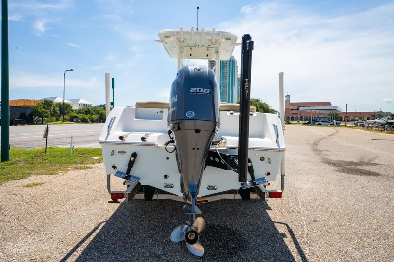 Slide: The Image of 2017 Sea Hunt Ultra 225 boat with Yamaha 200 engine, parked on a sunny day. - 19