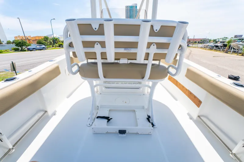 Slide: The Image of 2017 Sea Hunt Ultra 225 boat interior with seating and rod holders. - 21