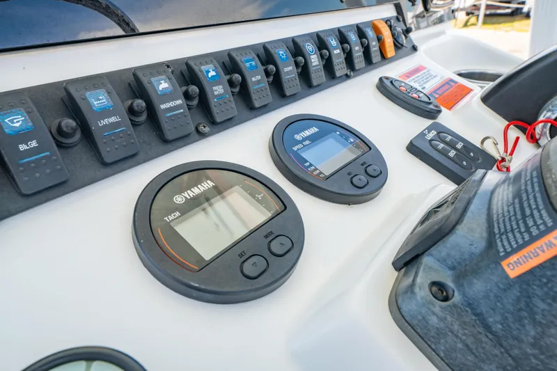 Slide: The Image of Control panel of 2017 Sea Hunt Ultra 225 boat with Yamaha gauges and switches. - 25