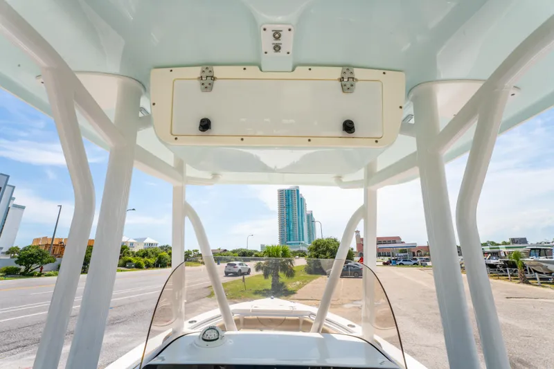 Slide: The Image of 2017 Sea Hunt Ultra 225 boat console with cityscape background. - 26