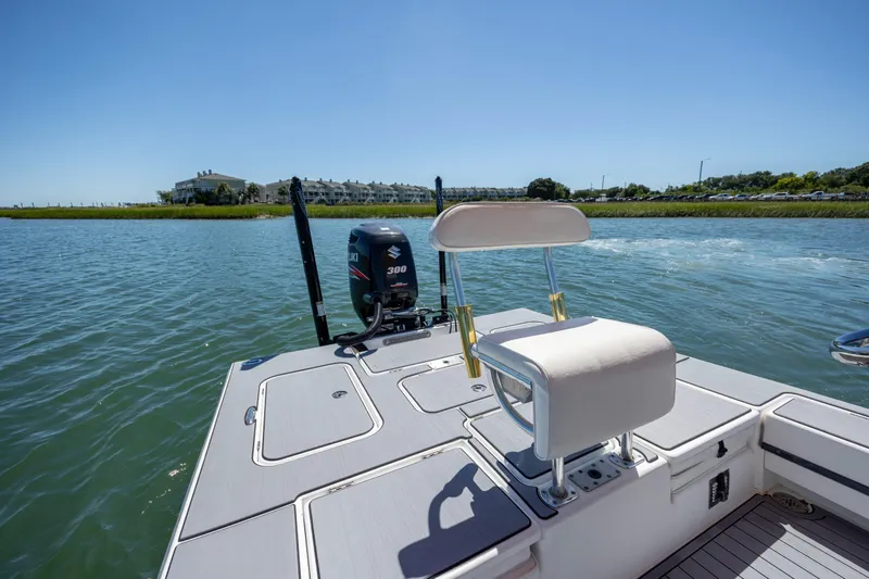 Slide: The Image of 2008 Release Tarpen Bay 21 boat with Suzuki 300 engine on calm water. - 12