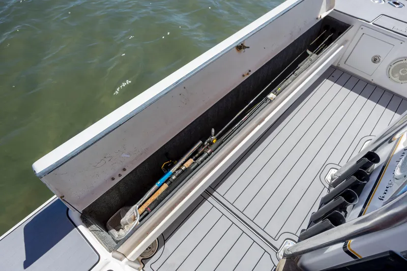 Slide: The Image of 2008 Release Tarpen Bay 21 boat with fishing rod storage compartment. - 21