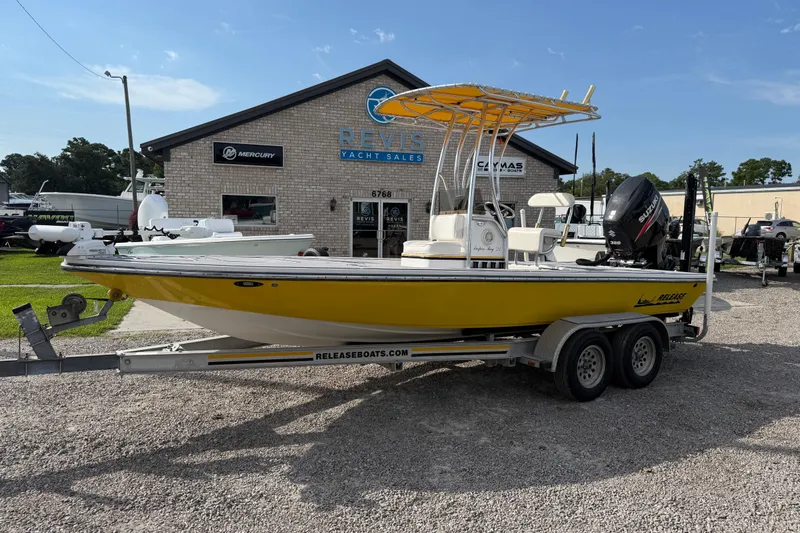 Slide: The Image of Yellow 2008 Release Tarpen Bay 21 boat on trailer at yacht sales lot. - 9