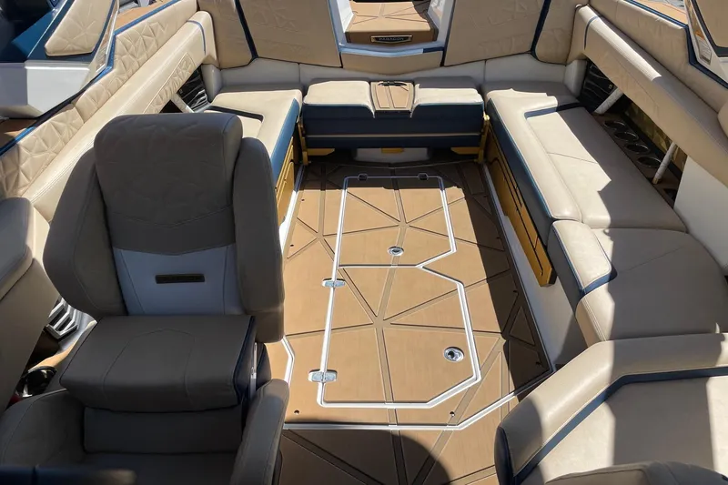 Slide: The Image of Luxurious interior of 2024 Nautique Super Air Nautique G25 Paragon boat, featuring premium seating. - 12