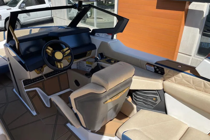 Slide: The Image of 2024 Nautique Super Air Nautique G25 Paragon interior with luxurious seating and modern dashboard. - 6