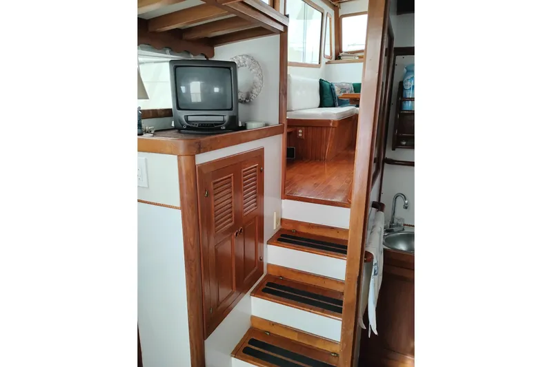 Slide: The Image of Interior of 1979 Transpac Eagle 36 Trawler with wooden stairs and vintage TV. - 19