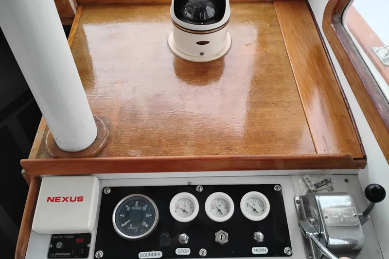 Slide: The Image of Control panel of a 1979 Transpac Eagle 36 Trawler with gauges and switches. - 23