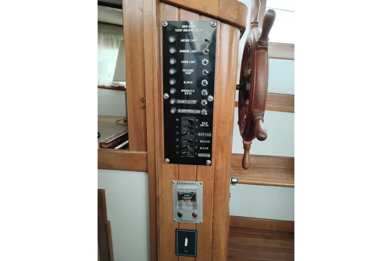 Slide: The Image of 1979 Transpac Eagle 36 Trawler control panel with wooden steering wheel. - 26