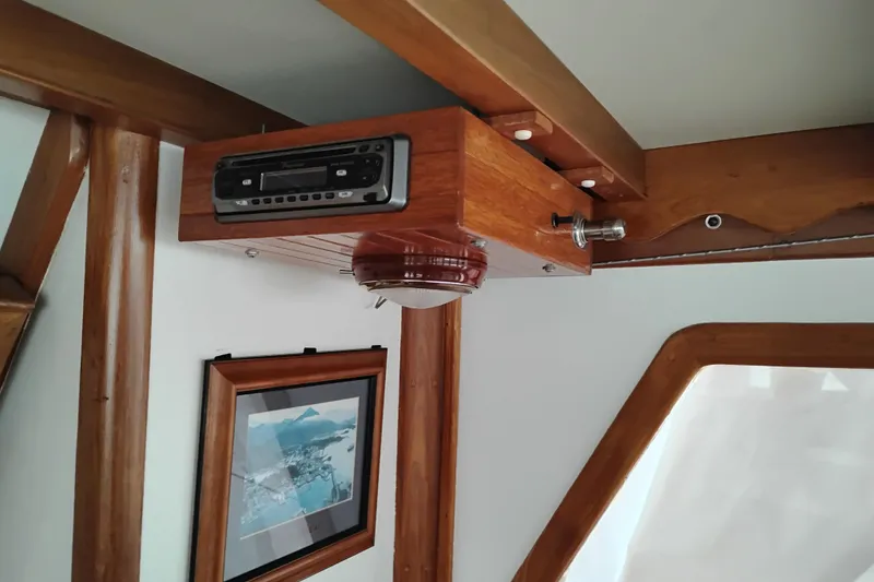 Slide: The Image of Interior of 1979 Transpac Eagle 36 Trawler with wooden paneling and framed artwork. - 34