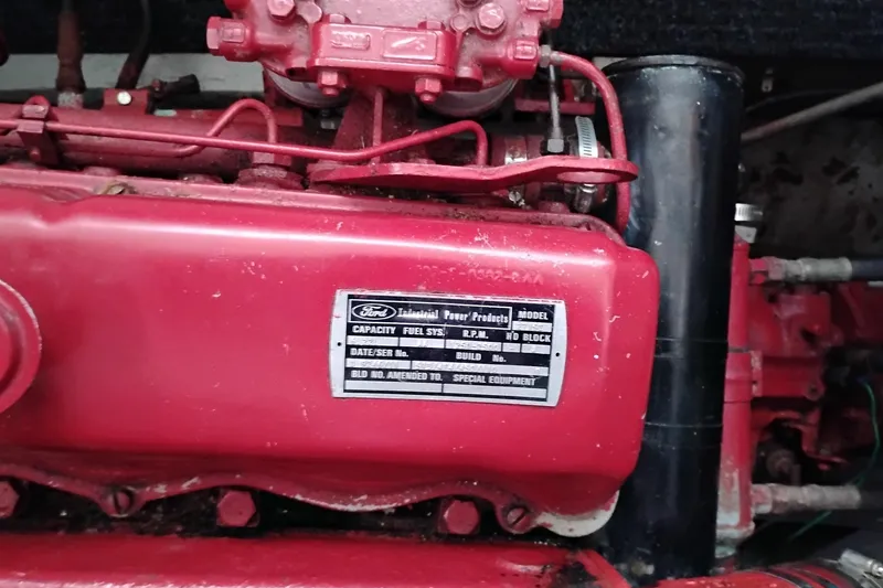 Slide: The Image of Engine of 1979 Transpac Eagle 36 Trawler, featuring red components and visible label. - 44