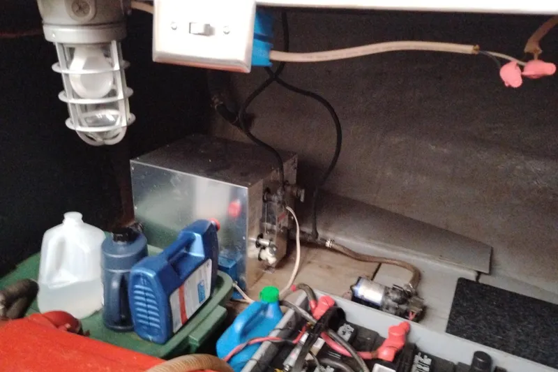 Slide: The Image of Engine room of 1979 Transpac Eagle 36 Trawler with maintenance supplies and wiring. - 46